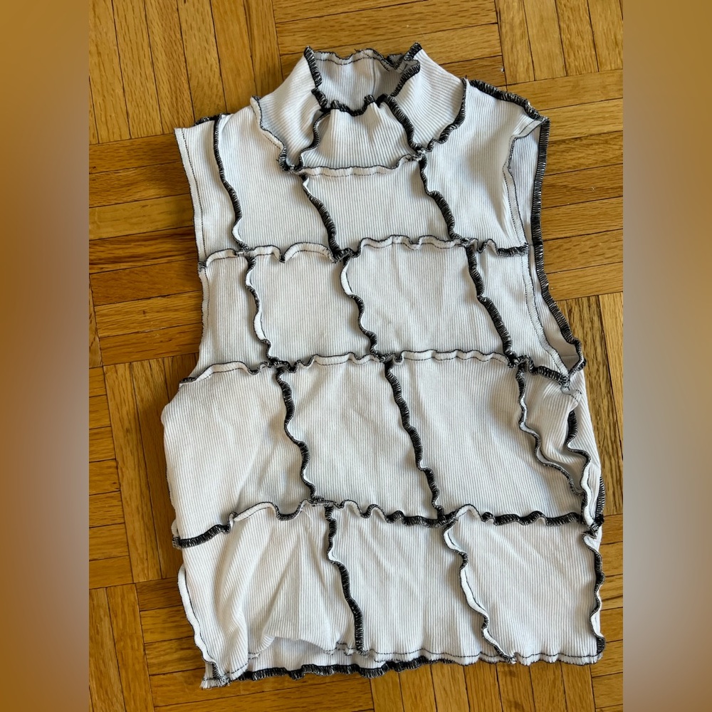 WHITE TURTLENECK TANK WITH BLACK STITCHING. Size S/M